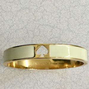 Gorgeous Kate Spade “Hole Punch” Spade bangle.